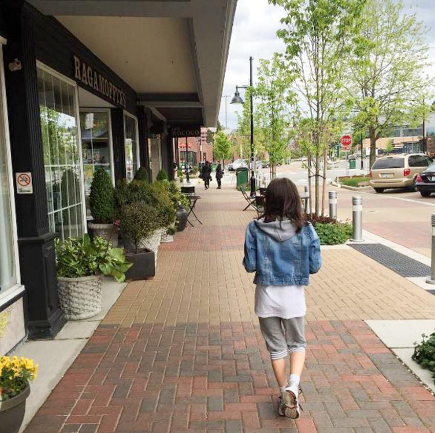 Here’s my daughter walking “downtown” Kirkland. Don’t you love the brick sidewalks? (Courtesy of Michelle Sutter)