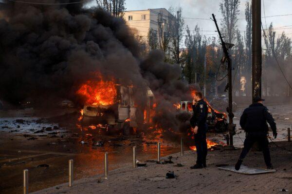 Cars are on fire after Russian missile strikes in Kyiv, Ukraine, on Oct. 10, 2022. (Valentyn Ogirenko/Reuters)