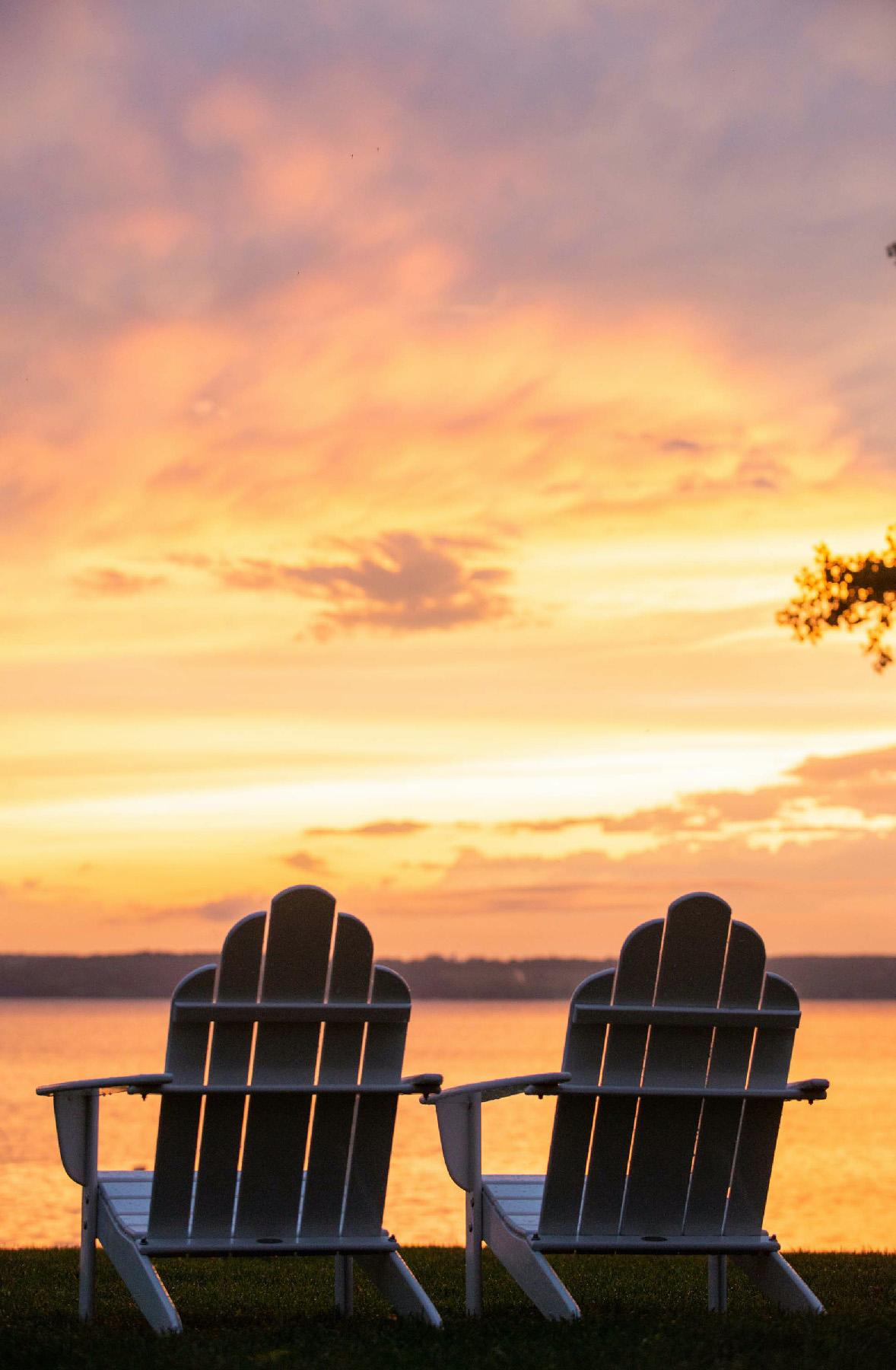 Adirondack chairs overlooking Cayuga Lake in the Finger Lakes region of New York, provide the perfect end to a day of exploring the area. (Photo courtesy of Inns of Aurora.)