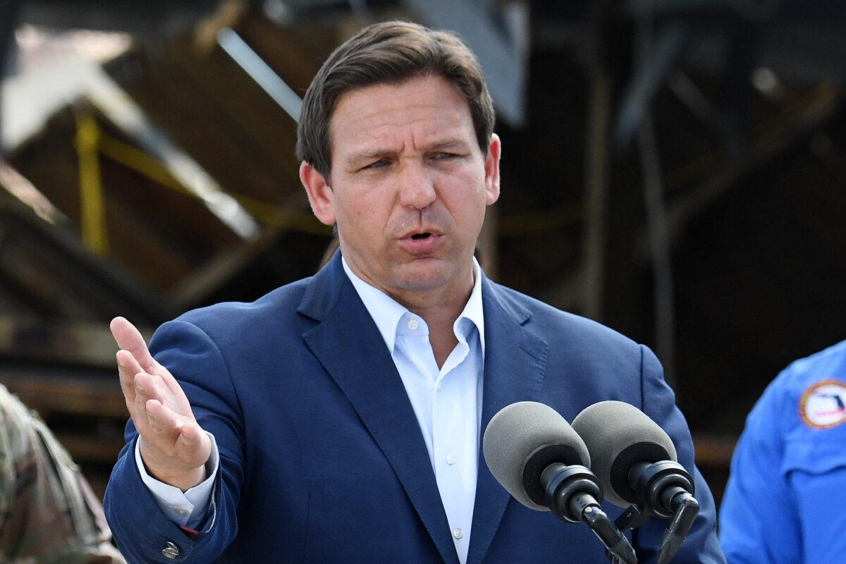 Florida Governor Ron DeSantis speaks in a neighborhood impacted by Hurricane Ian at Fisherman's Wharf in Fort Myers, Fla., on Oct. 5, 2022. (Olivier Douliery/AFP via Getty Images)