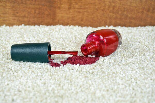red nail polish spill on light colored carpet