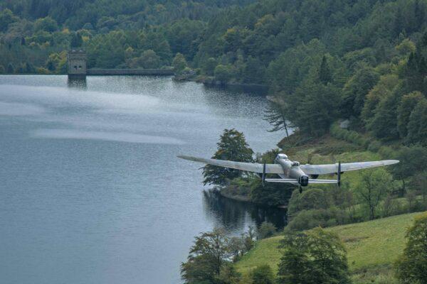 A British Lancaster bomber approaches a dam in a scene from the documentary "Lancaster." (Gravitas Ventures)