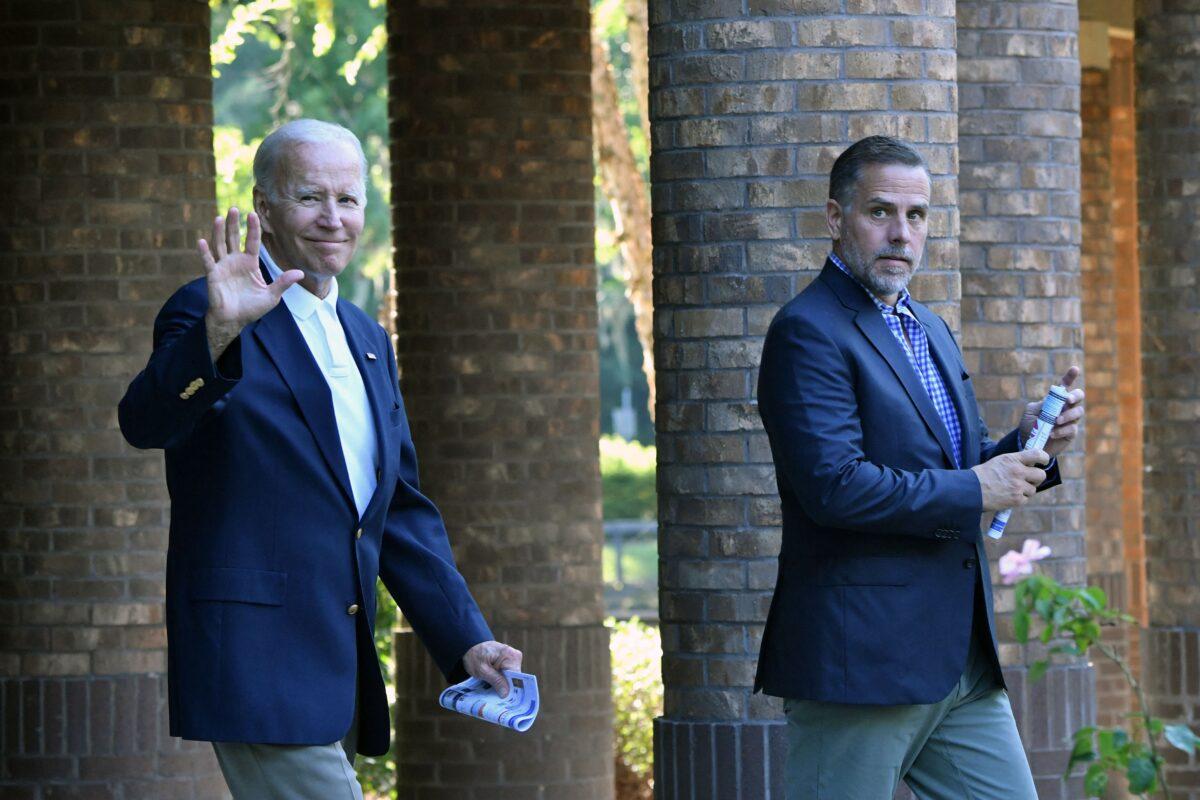 U.S. President Joe Biden (L) waves alongside his son Hunter Biden after attending mass at Holy Spirit Catholic Church in Johns Island, S.C., on Aug. 13, 2022. (Nicholas Kamm/AFP via Getty Images)