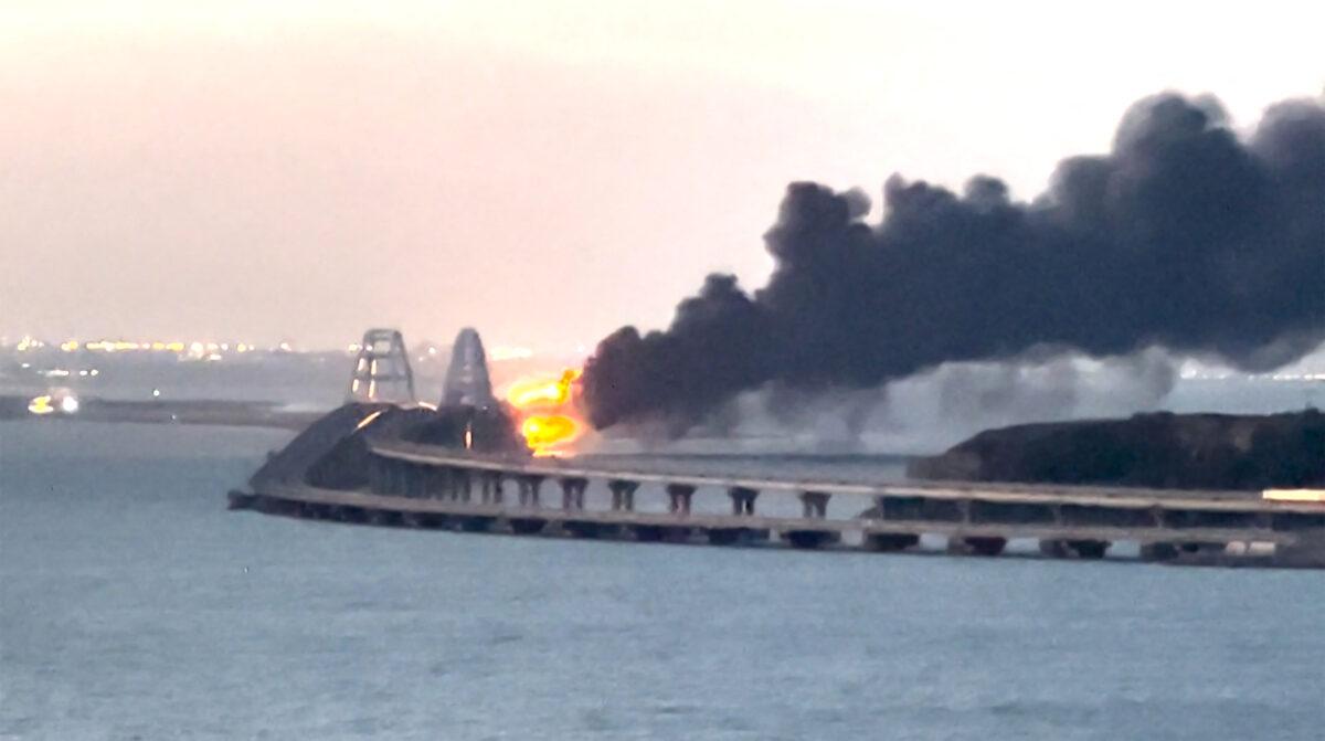 Thick black smoke rises from a fire on the Kerch Bridge that links Crimea to Russia on Oct. 8, 2022, in a still from video. (AFP via Getty Images)