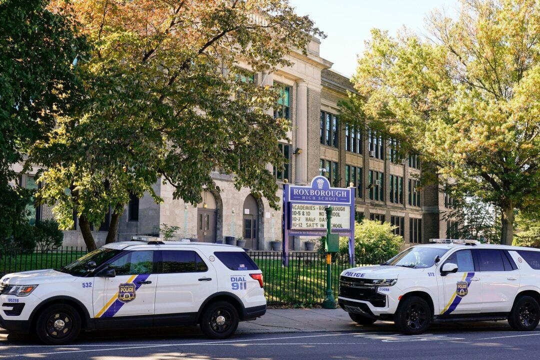2 in Custody, 2 Sought in Fatal Shooting Outside High School