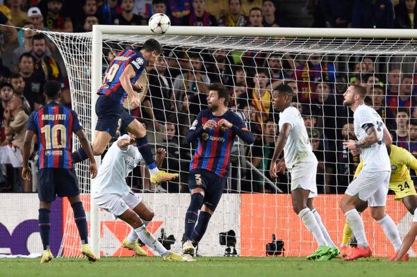 Barcelona's Polish forward Robert Lewandowski scores his team's third goal during the UEFA Champions League 1st round, group C, football match between FC Barcelona and Inter Milan at the Camp Nou stadium in Barcelona, Spain, on October 12, 2022. (Josep Lago/AFP via Getty Images)