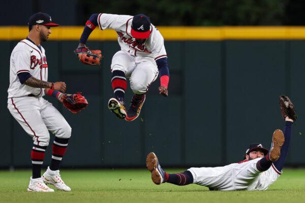 Dansby Swanson (7) of the Atlanta Braves catches an out against the Philadelphia Phillies during the sixth inning in game two of the National League Division Series at Truist Park in Atlanta, on Oct. 12, 2022. (Patrick Smith/Getty Images)