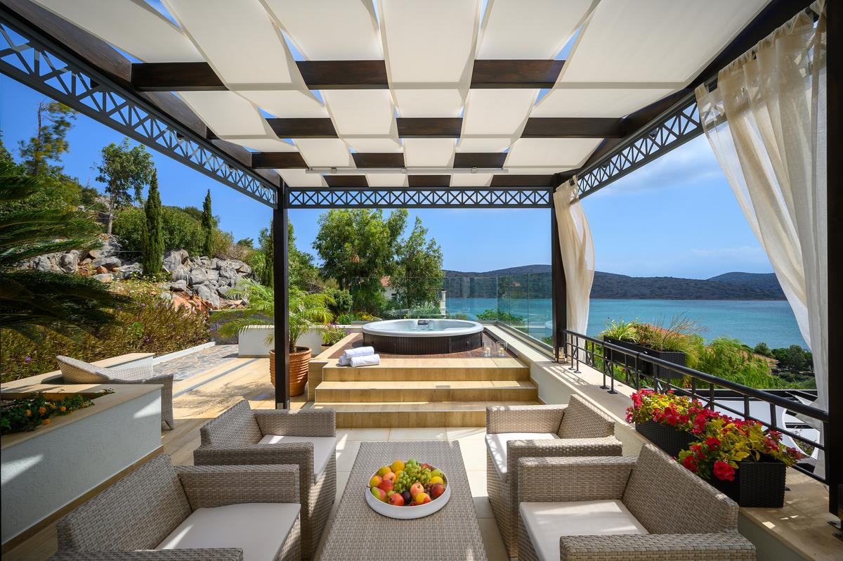 The upper-level master suite in the main house features its own private balcony and jacuzzi. (Courtesy of Greece Sotheby's International Realty)