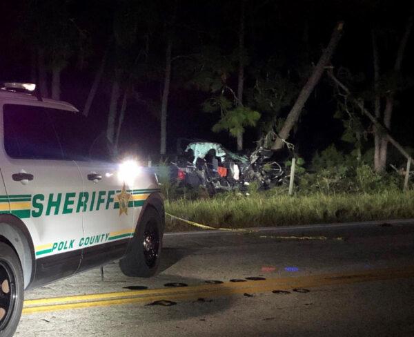 The scene of a car crash that resulted in the death of a 22-month-old boy and seriously injured a 5-year-old boy. The female driver was intoxicated and in the United States on an expired work visa, police said.  (Courtesy, Polk County Sheriff's Department)