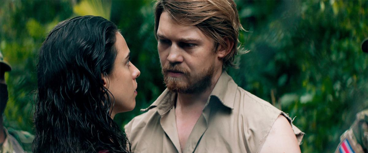 Margaret Qualley plays a struggling journalist and Joe Alwyn plays a mysterious businessman in Claire Denis’s “Stars at Noon.” (A24)