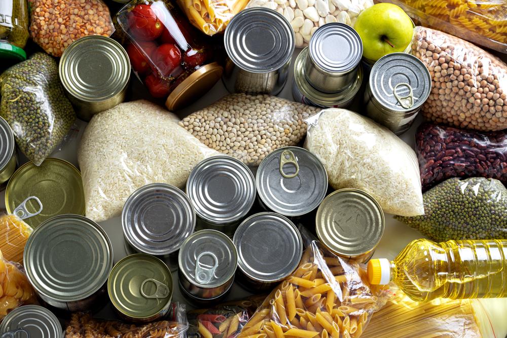 Canned vegetables, fruits, meats, and beans can act as foundational ingredients for many meals. (FabrikaSimf/Shutterstock)