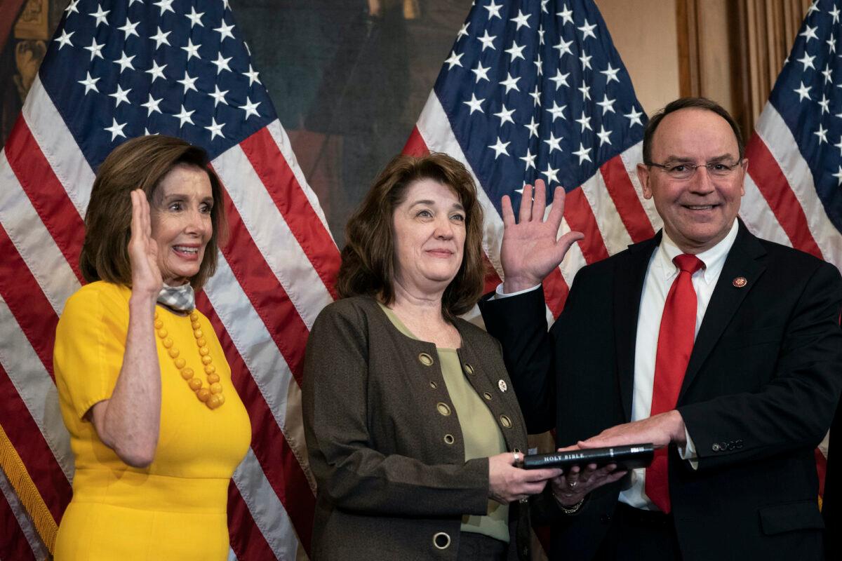 L-R) Then-Speaker of the House Nancy Pelosi participates in a ceremonial swearing-in with new Rep. Tom Tiffany (R-Wis.), with wife Christine, at the U.S. Capitol in Washington on May 19, 2020. (Drew Angerer/Getty Images)