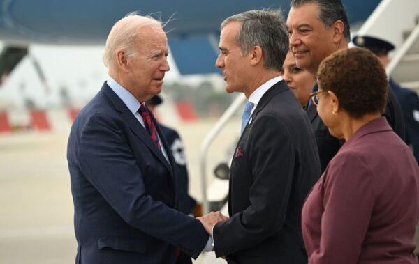 US President Joe Biden is greeted by LA mayor Eric Garcetti as he arrives at Los Angeles International Airport in California on Oct. 12, 2022. (Saul Loeb/AFP via Getty Images)
