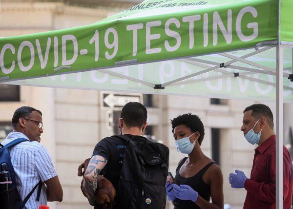 People wait to take coronavirus disease (COVID-19) tests at a pop-up testing site in New York on July 11, 2022. (Brendan McDermid/Reuters)