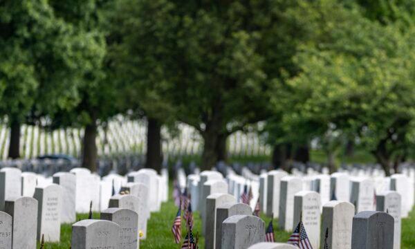 Headstones with American flags are seen at Arlington National Cemetery in Arlington, Va., on May 30, 2022. (Tasos Katopodis/Getty Images)