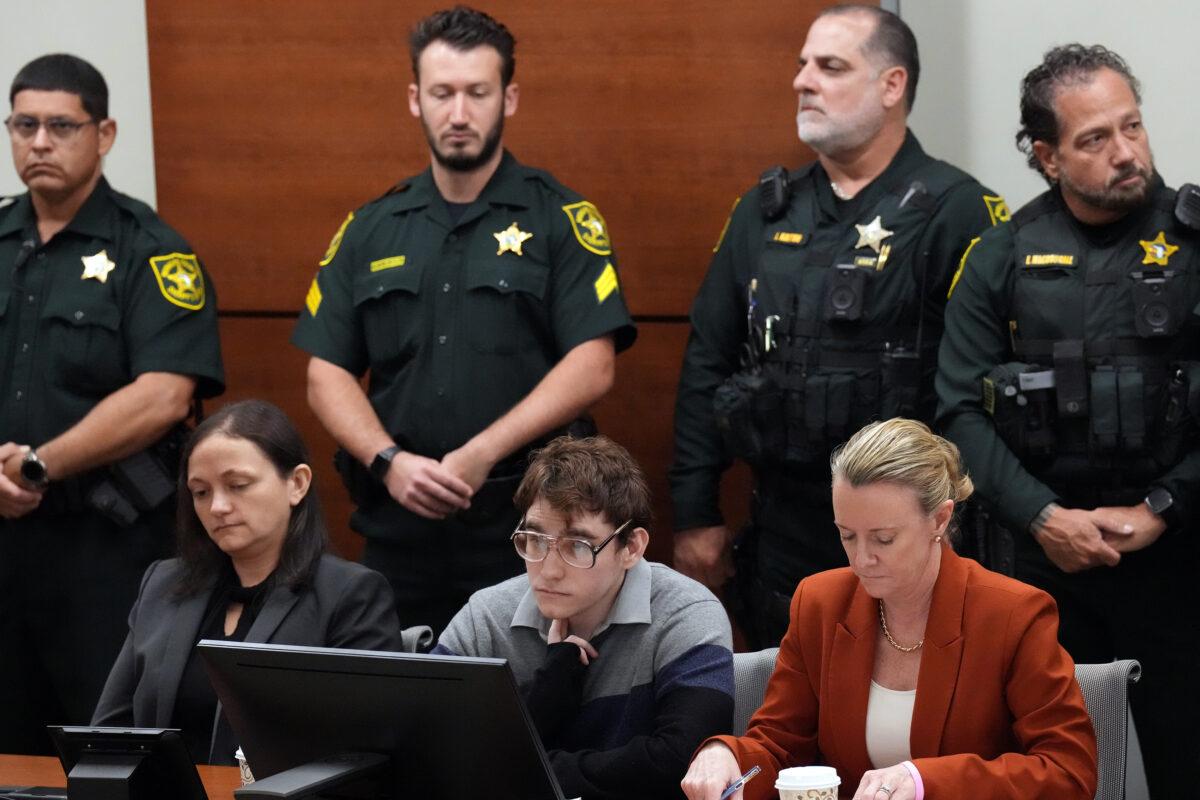Marjory Stoneman Douglas High School shooter Nikolas Cruz, seated with sentence mitigation specialist Kate O'Shea, left, and Assistant Public Defender Melisa McNeil, in court as verdicts are read in his trial in Fort Lauderdale, Fla., on Oct. 13, 2022. (Amy Beth Bennett/Pool/Getty Images)