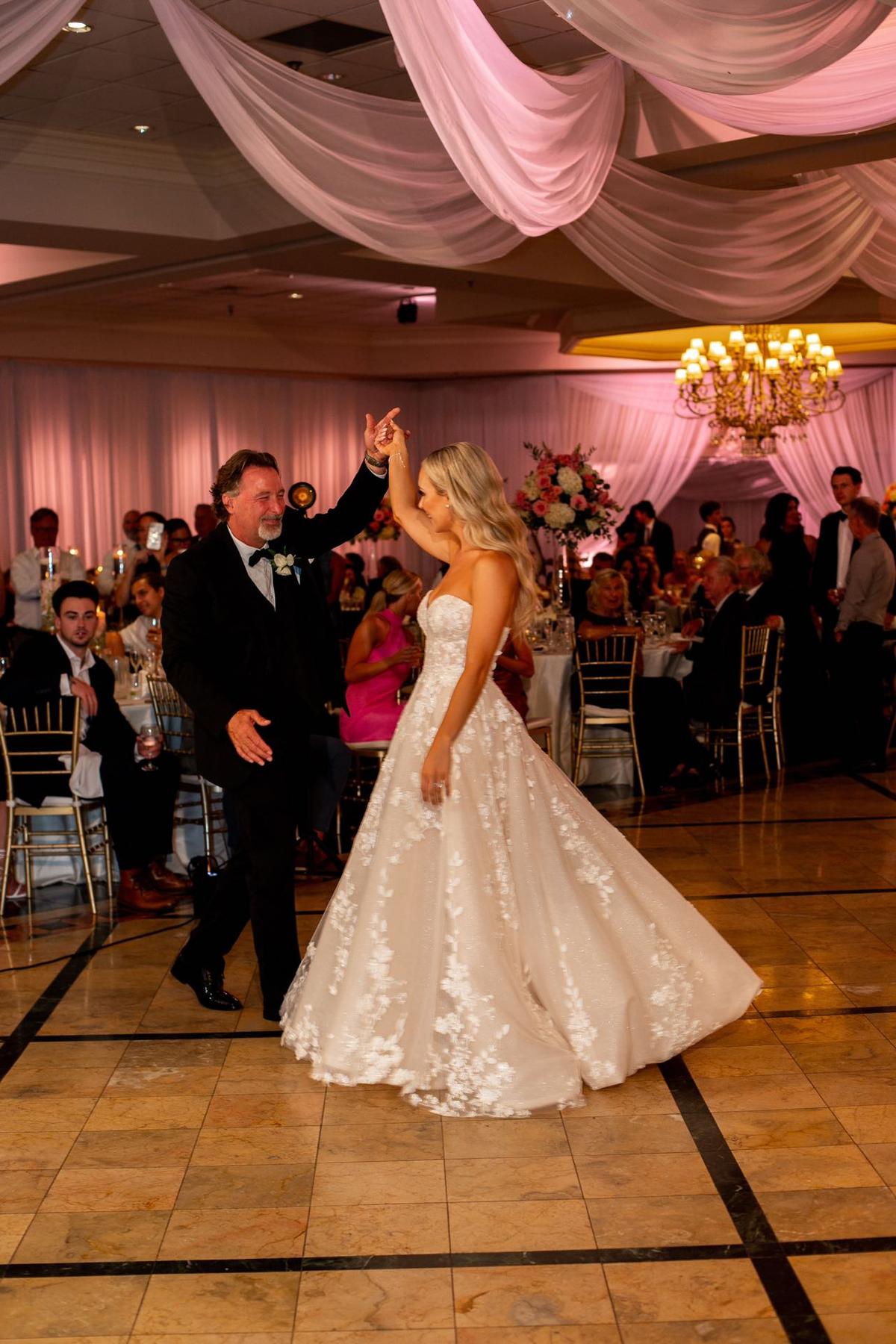Cassi and her father Steve dancing at her wedding. (Courtesy of <a href="https://www.instagram.com/cassiadams_/">Cassi Adams</a>)