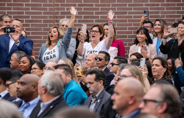 Women wear "Free Iran" shirts in a crowd listening to President Joe Biden at Irvine Valley College in Irvine, Calif., on Oct. 14, 2022. (John Fredricks/The Epoch Times)