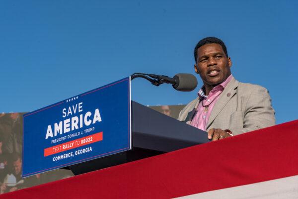 Heisman Trophy winner and Republican candidate for U.S. Senate Herschel Walker speaks to supporters of former U.S. President Donald Trump during a rally at the Banks County Dragway in Commerce, Ga. on March 26, 2022. (Megan Varner/Getty Images)