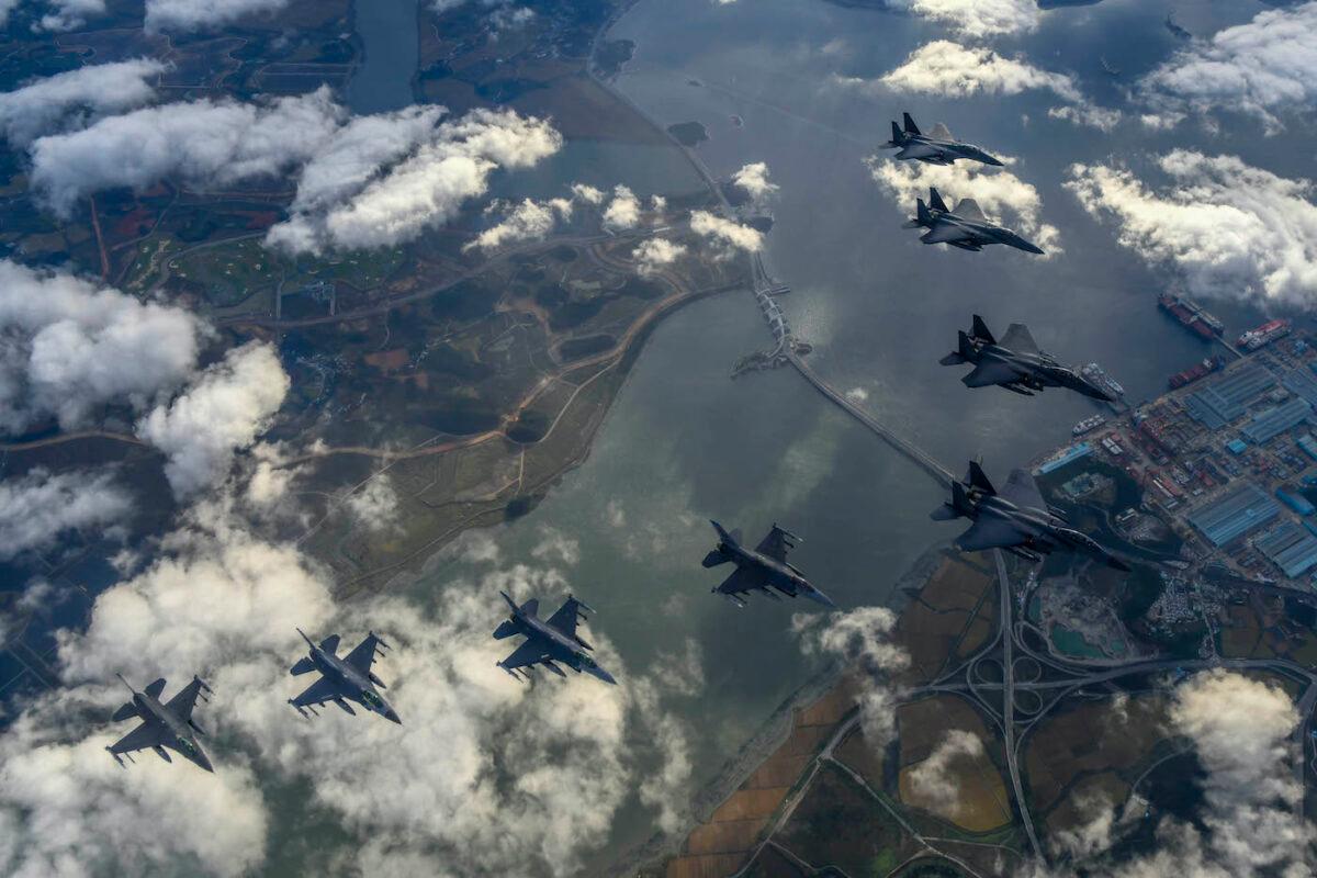 South Korean Air Force F-15Ks and U.S. Air Force F-16 fighter jets fly over the Korean Peninsula in response to North Korea's intermediate-range ballistic missile launch earlier in the day on Oct. 4, 2022. (South Korean Defense Ministry via Getty Images)