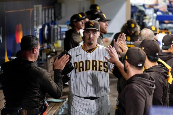 San Diego Padres starting pitcher Blake Snell is greeted by teammates after exiting during the sixth inning in Game 3 of a baseball NL Division Series against the Los Angeles Dodgers, in San Diego, on Oct. 14, 2022. (Ashley Landis/AP Photo)