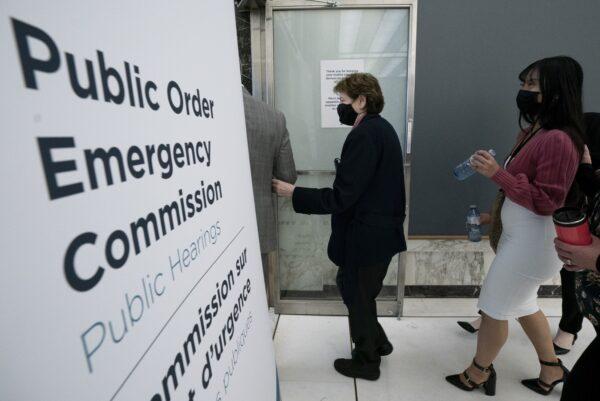 Witnesses arrive at the Public Order Emergency Commission hearing in Ottawa on Oct. 14, 2022. (The Canadian Press/Adrian Wyld)