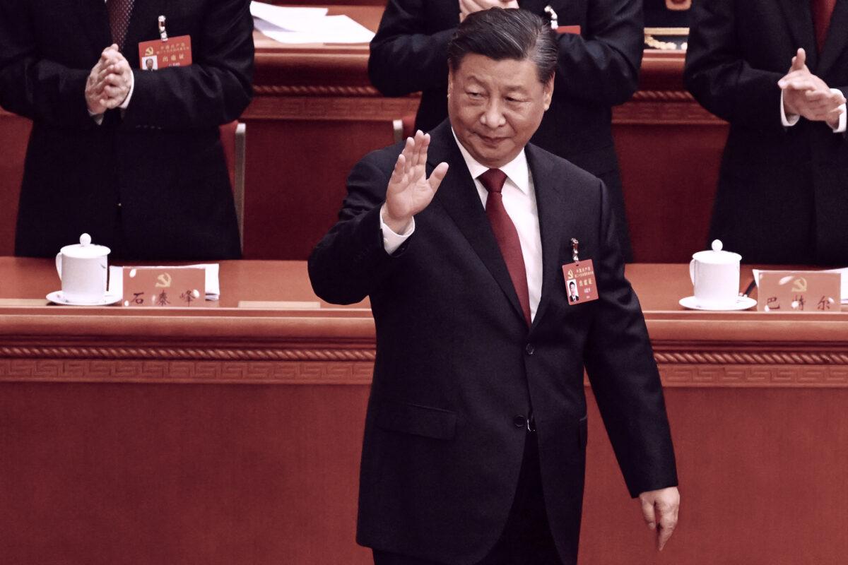 China's leader Xi Jinping waves as he arrives for the opening session of the 20th Chinese Communist Party's Congress in Beijing on Oct. 16, 2022. (Noel Celis / AFP via Getty Images)