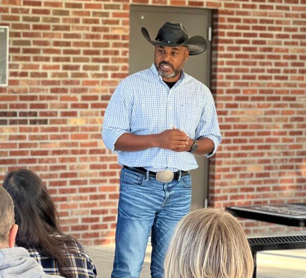 Marcus Flowers, Democratic nominee for Georgia's 14th Congressional District against incumbent Marjorie Taylor Greene (R-Ga.), wears his trademark cowboy hat as he speaks at a party event last week.  (Photo courtesy of the Flowers campaign.)