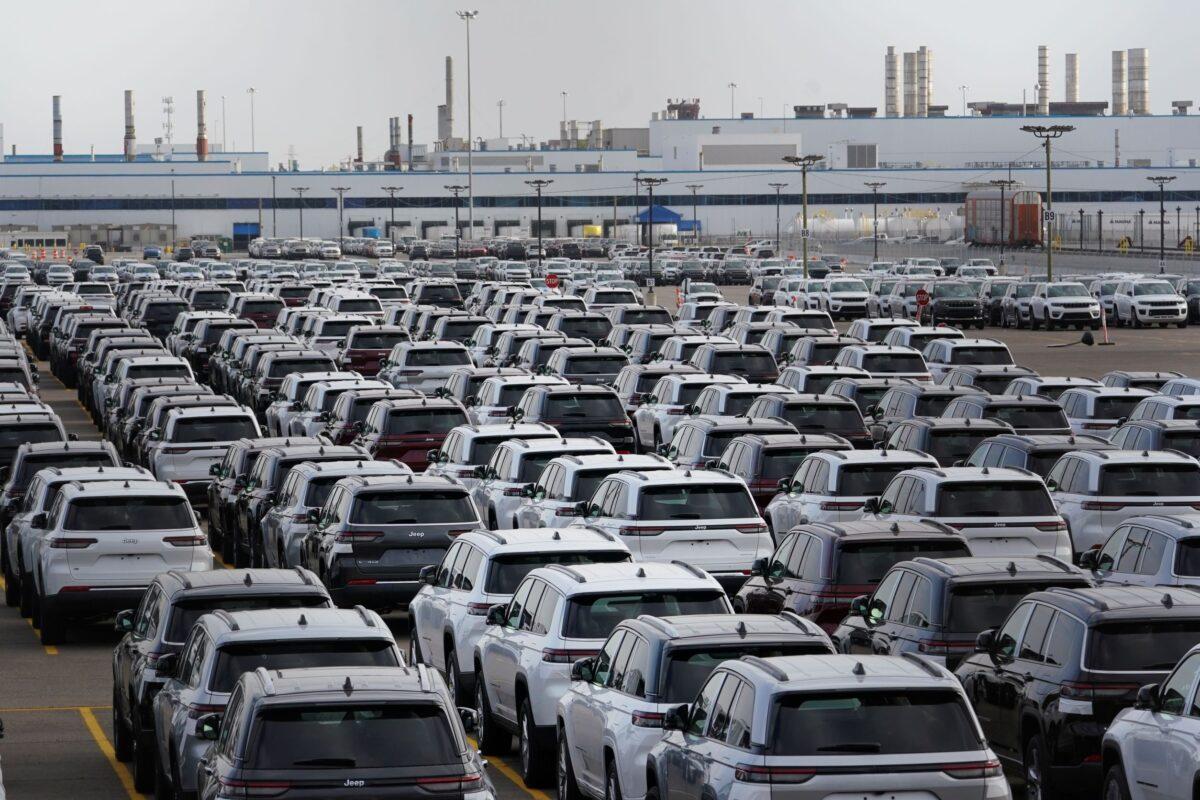 New vehicles are parked in storage lots near the the Stellantis Detroit Assembly Complex in Detroit on Oct. 5, 2022. (Paul Sancya/AP Photo)