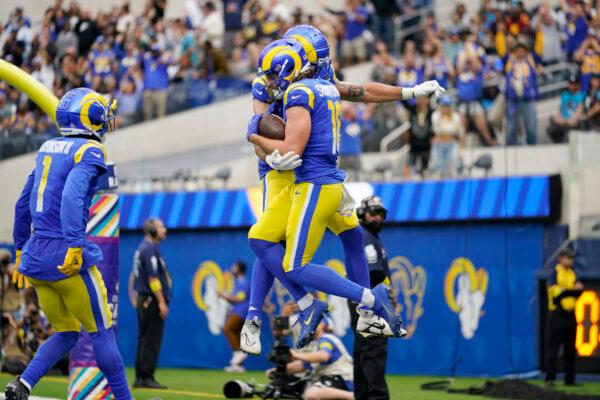 Los Angeles Rams wide receiver Ben Skowronek, with ball, leaps in celebration after scoring a touchdown during the second half of an NFL football game against the Carolina Panthers in Inglewood, Calif., Oct. 16, 2022. (Ashley Landis/AP Photo)