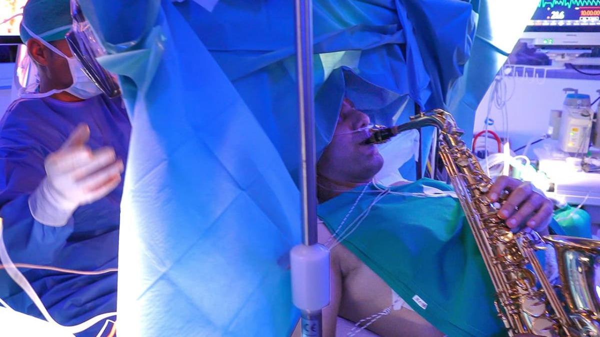The patient identified as "G. Z." plays the saxophone while undergoing brain surgery. (Courtesy of Paideia International Hospital)