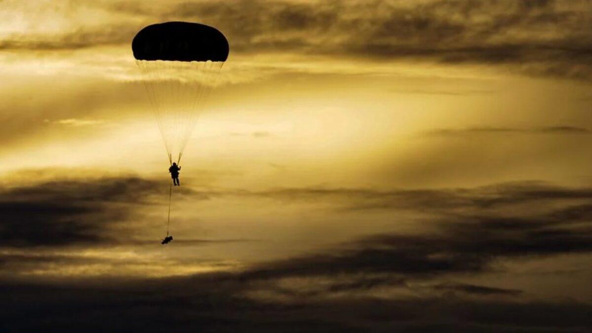 An Army paratrooper descends from the sky during Exercise Forager 21 at Andersen Air Force Base, Guam, on July 30, 2021. (Master Sgt. Richard Ebensberger/U.S. Air Force)