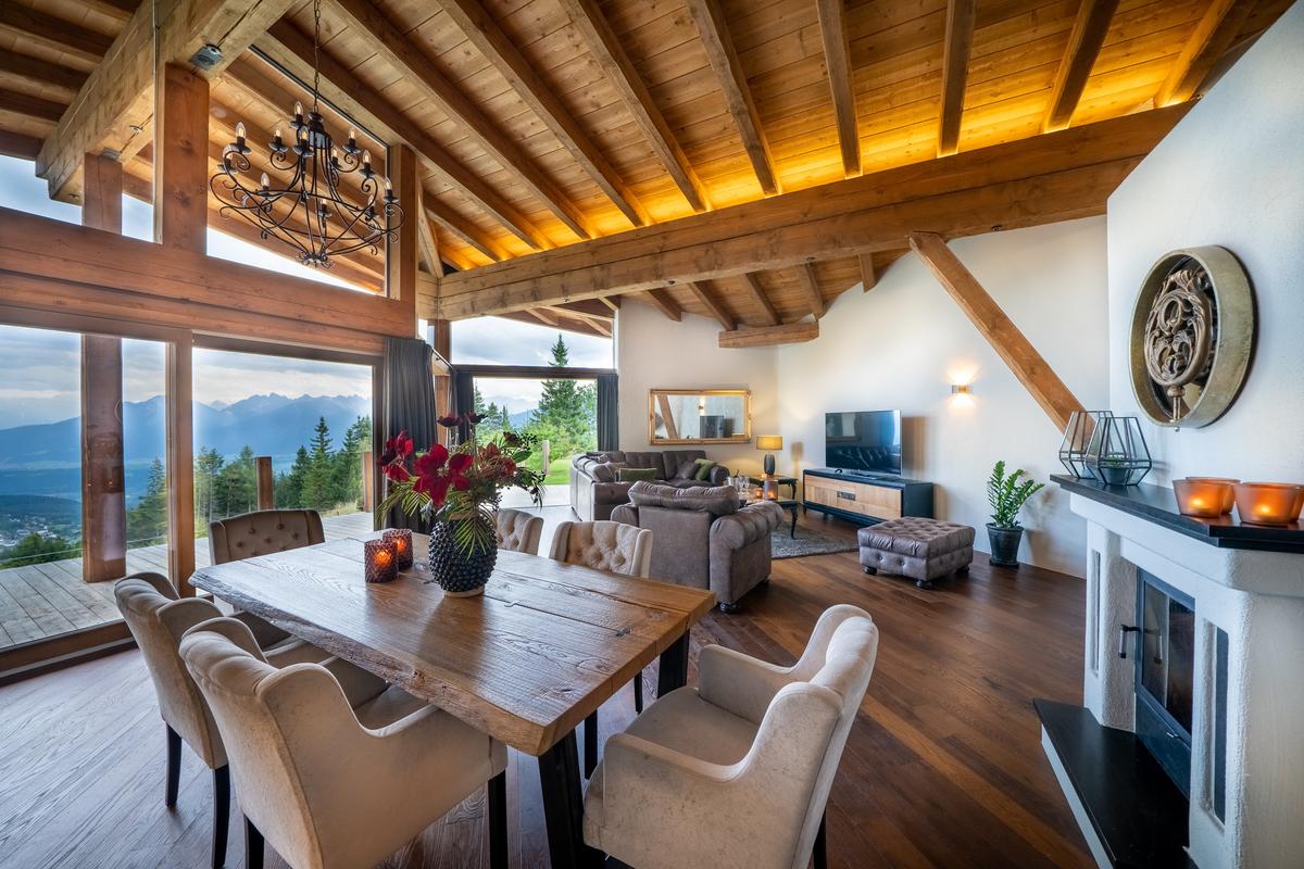 This cozy dining area enjoys a most impressive view of the surrounding mountains and countryside. (Courtesy of the property owners, Sotheby's Concierge Auctions)