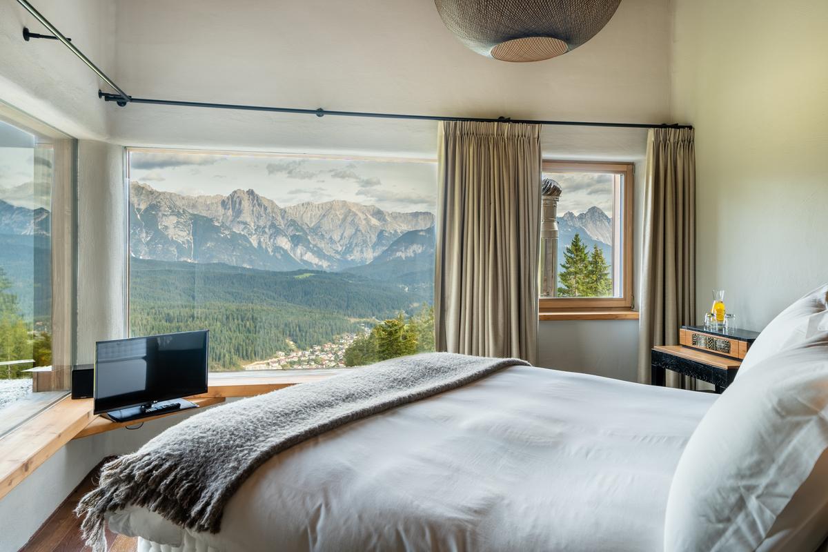 This bedroom overlooks the village of Seefeld, home to the 1964 and 1976 Olympic Winter Games. (Courtesy of the property owners, Sotheby's Concierge Auctions)
