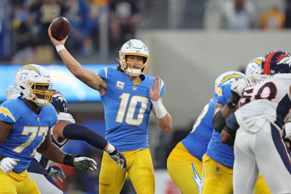 Justin Herbert (10) of the Los Angeles Chargers looks to pass during the second quarter against the Denver Broncos at SoFi Stadium in Inglewood, Calif., on Oct. 17, 2022. (Sean M. Haffey/Getty Images)