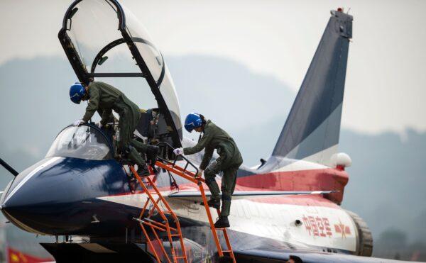 This picture taken on Nov. 11, 2014 shows Chinese female J-10 fighter pilot Yu Xu leaving the plane after performing at the Airshow China in Zhuhai, south China's Guangdong province.<br/>The first woman to fly China's J-10 fighter plane was killed in a crash during an aerobatics training exercise, state-run media reported on Nov. 14, 2016. (Johannes Eisele/AFP via Getty Images)