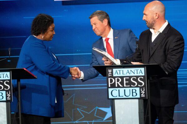 Shane Hazel, (R), could throw Georgia's governor race Nov. 8 into a runoff. The Libertarian is pictured here with Stacey Abrams (L), the Democratic nominee and incumbent Republican Governor Brian Kemp (C) at the Atlanta Press Club debate on Oct. 17, 2022. (Ben Gray/AP Photo)
