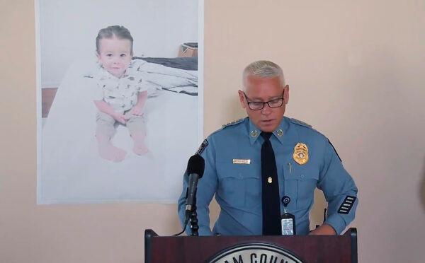Chatham County Police Chief Jeff Hadley speaks to reporters as he stands in front of a large photo of missing toddler Quinton Simon at a police operations center being used in the search for the boy's remains just outside Savannah, Ga., on Oct. 18, 2022. (WSAV-TV via AP)