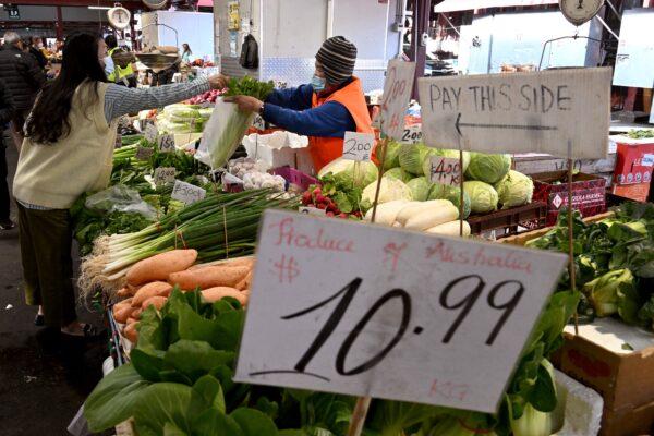 People shop for fruit and vegetables at Victoria Market in Melbourne, Australia, on July 5, 2022. (William West/AFP via Getty Images)