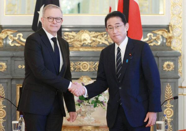 Australia's Prime Minister Anthony Albanese (L) shakes hands with Japan's Prime Minister Fumio Kishida during their meeting in Tokyo on Sept. 27, 2022, (Japan Pool Via Jiji Press/Jiji Press/AFP via Getty Images)