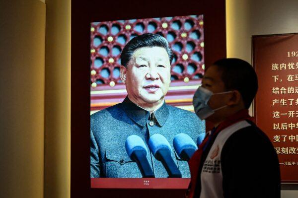 An image of China's leader Xi Jinping is seen at an exhibition about history of the Communist Party of China at Peking University in Beijing on October 7, 2022. (Photo by Jade Gao / AFP via Getty Images)