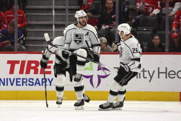 Phillip Danault (24) of the Los Angeles Kings celebrates his game winning overtime goal with teammates to beat the Detroit Red Wings 5–4 at Little Caesars Arena in Detroit, Oct. 17, 2022. (Gregory Shamus/Getty Images)