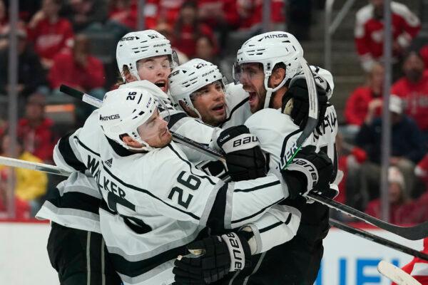 Los Angeles Kings center Anze Kopitar, right, celebrates his goal against the Detroit Red Wings in the third period of an NHL hockey game in Detroit, Oct. 17, 2022. (Paul Sancya/AP Photo)
