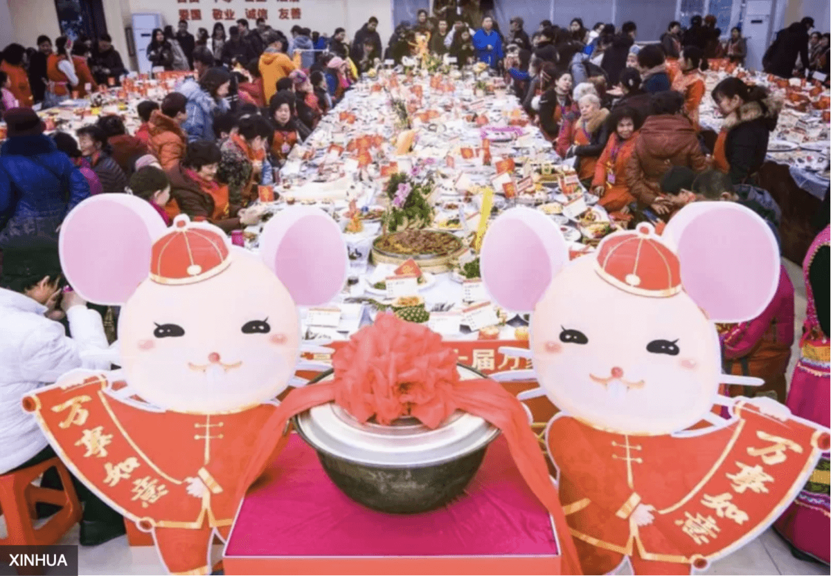  Screenshot of a Chinese media report on Wuhan city's Ten Thousand Families annual Chinese New Year Banquet on Jan. 18, 2020. (The Epoch Times)