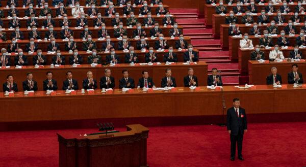 (Bottom right) Chinese leader Xi Jinping is applauded by senior members of the government and delegates before his speech during the opening ceremony of the CCP's rubber-stamp legislature in Beijing, China, on Oct. 16, 2022. (Kevin Frayer/Getty Images)