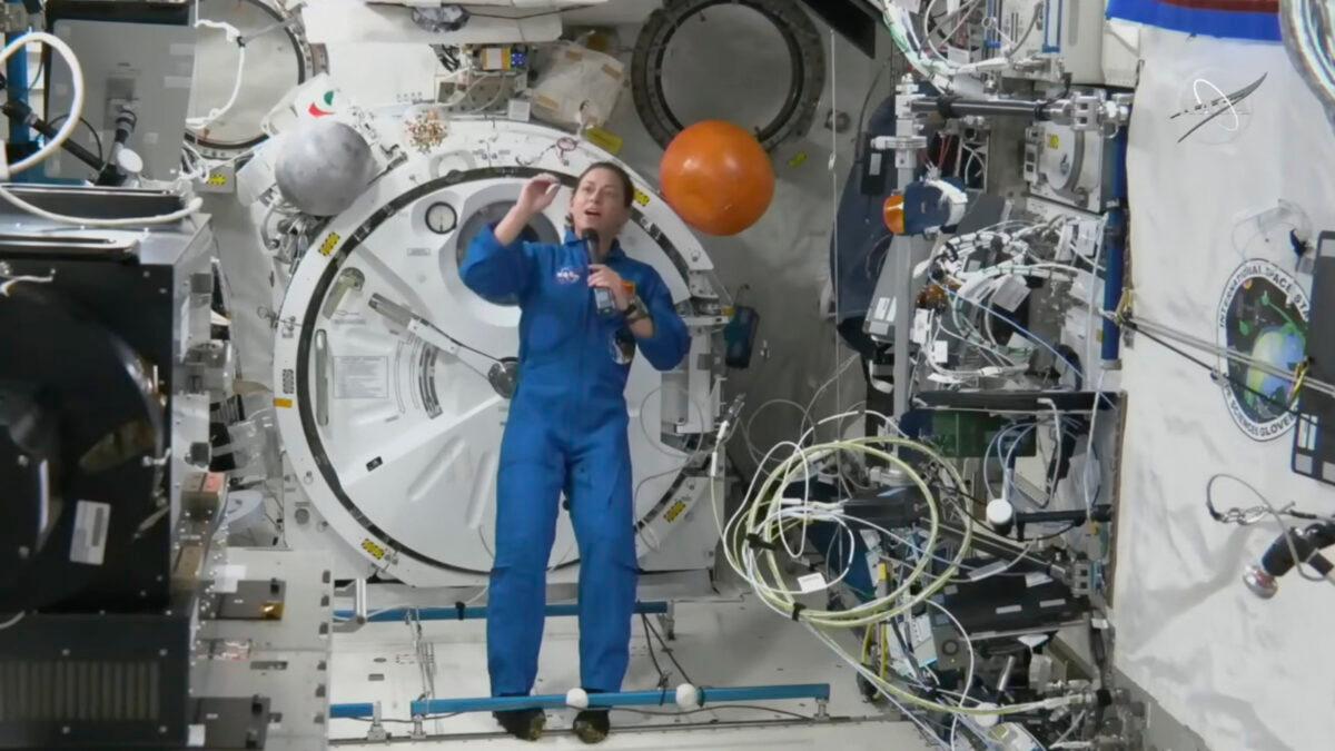 Astronaut Nicole Mann shows her dream catcher during an interview on Oct. 19, 2022, in a still from video. (NASA via AP)