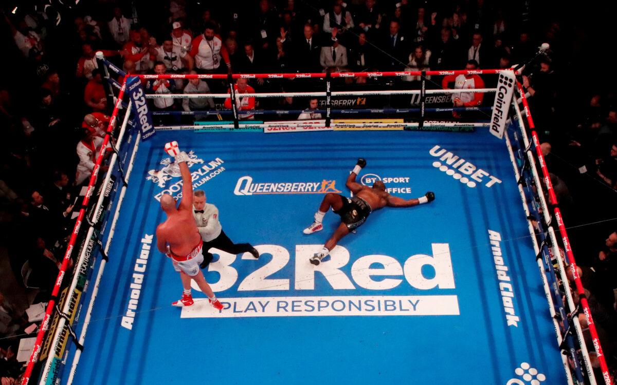 Tyson Fury celebrates after knocking down Dillian Whyte during the WBC World Heavyweight Title Fight at Wembley Stadium in London on April 23, 2022. (Andrew Couldridge/Action Images via Reuters)