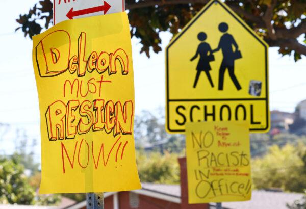 Signs calling for the resignation of L.A. City Council member Kevin de Leon are posted near de Leon's home in the wake of a leaked audio recording in Los Angeles, Calif., on Oct. 18, 2022. (Mario Tama/Getty Images)