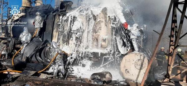 Firefighters work to put out a fire in an energy infrastructure facility that was hit by a Russian missile in Zhytomyr, Ukraine, on Oct. 18, 2022. (State Emergency Service of Ukraine/Handout via Reuters)