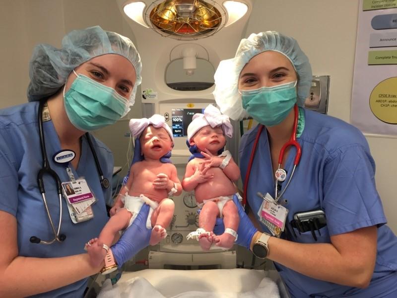 Nurses Emma and Julia with twins Emma and Julia. (Courtesy of <a href="https://healthonecares.com/locations/rose/">Rose Medical Center</a>)